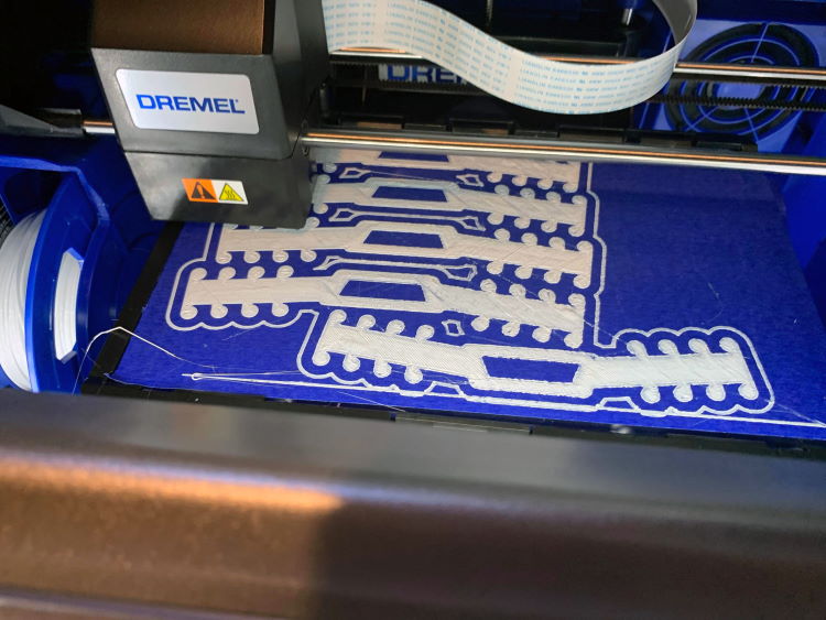 KHCPL’s 3D printer making the ear-savers.