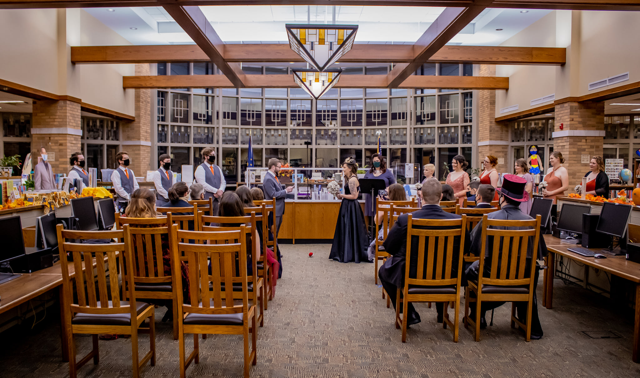 The couple exchanged vows at the reference desk, the quasi-altar.